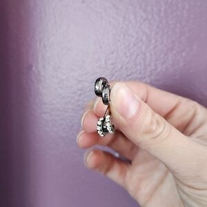 Set of tiny hoop post earrings in dark hammered metal and rhinestone pave